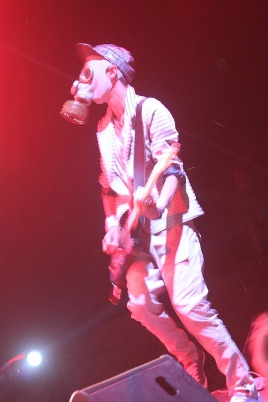 Roman performing on stage in red light